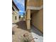 The side yard features low maintenance landscaping with rock cover, providing a clean and simple aesthetic at 6476 Ness Gardens Ct, Las Vegas, NV 89122