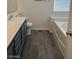 Bathroom featuring a sink, toilet, and bathtub with tiled walls at 6532 Moon Roses Ct, Las Vegas, NV 89108