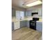 Kitchen with ample counter space and gray cabinets at 6532 Moon Roses Ct, Las Vegas, NV 89108