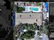 An aerial view of a home with a pool, outdoor kitchen, lush backyard, and ample parking at 6540 Tara Ave, Las Vegas, NV 89146
