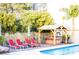 Inviting backyard with pool, hot tub, gazebo, and lounge chairs, perfect for relaxing outdoors at 6540 Tara Ave, Las Vegas, NV 89146