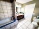 Bathroom features tiled tub and tile flooring, creating a clean and stylish space at 6540 Tara Ave, Las Vegas, NV 89146