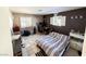 Comfortable bedroom with tile flooring provides a peaceful retreat for rest and relaxation at 6540 Tara Ave, Las Vegas, NV 89146