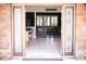 View from the entryway through the double doors into the bright and open interior at 6540 Tara Ave, Las Vegas, NV 89146