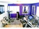 Home gym with various workout equipment, mirrors, and natural light from white plantation shutters at 6540 Tara Ave, Las Vegas, NV 89146