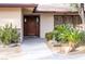 Inviting front entrance with well-maintained landscaping and a charming doorway at 6540 Tara Ave, Las Vegas, NV 89146