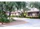 Single-story home with mature trees, desert landscaping, and long concrete driveway at 6540 Tara Ave, Las Vegas, NV 89146