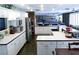 Bright kitchen boasts plentiful white cabinets, stainless steel appliances, and an inviting open layout at 6540 Tara Ave, Las Vegas, NV 89146