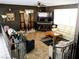 Inviting living room with tile floors, comfortable seating, and large television at 6540 Tara Ave, Las Vegas, NV 89146