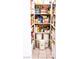 Well-stocked pantry offers ample storage with shelves filled with various food items in an organized manner at 6540 Tara Ave, Las Vegas, NV 89146