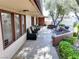 Covered patio with multiple seating areas and desert landscaping at 6540 Tara Ave, Las Vegas, NV 89146