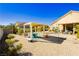 Desert landscaped backyard featuring a charming pergola with outdoor dining area and spacious gravel groundcover at 6617 Golden Bit Ave, Las Vegas, NV 89131