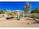 Inviting backyard with dining pergola, desert landscaping and low maintenance grounds at 6617 Golden Bit Ave, Las Vegas, NV 89131