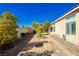 Low maintenance backyard with gravel, garden bed, and view of the home's exterior at 6617 Golden Bit Ave, Las Vegas, NV 89131