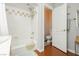 Bathroom with a combined bathtub and shower with tile backsplash at 6617 Golden Bit Ave, Las Vegas, NV 89131