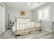 Bedroom featuring a metal bed frame and natural light at 6617 Golden Bit Ave, Las Vegas, NV 89131