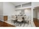 Dining room with a wood floor, decorative wainscoting, and modern chandelier at 6617 Golden Bit Ave, Las Vegas, NV 89131