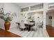 Bright dining room with modern light fixture, neutral paint, and decorative shelving at 6617 Golden Bit Ave, Las Vegas, NV 89131