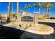 Steeplechase neighborhood entrance sign surrounded by lush palm trees and greenery at 6617 Golden Bit Ave, Las Vegas, NV 89131