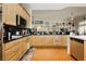 Well-appointed kitchen features granite countertops, stainless steel appliances, and ample cabinet space at 6617 Golden Bit Ave, Las Vegas, NV 89131