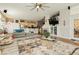 Spacious living room with an open floor plan, comfortable seating, and ample natural light at 6617 Golden Bit Ave, Las Vegas, NV 89131