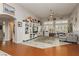 Bright living room with a soaring ceiling, decorative shelving, and a large window for ample natural light at 6617 Golden Bit Ave, Las Vegas, NV 89131
