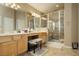 Bright bathroom with dual sinks, a glass-enclosed shower, and neutral tile finishes for a spa-like atmosphere at 6617 Golden Bit Ave, Las Vegas, NV 89131