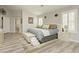 Bedroom with neutral walls, shuttered windows, and access to the main bath at 6617 Golden Bit Ave, Las Vegas, NV 89131