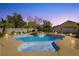 Backyard pool and spa area with mature desert landscaping and block wall surround at 6617 Golden Bit Ave, Las Vegas, NV 89131
