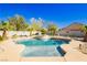 Backyard pool and spa offer a serene retreat with mature trees and landscaping at 6617 Golden Bit Ave, Las Vegas, NV 89131