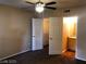 Bedroom featuring carpeted floors, a ceiling fan, and closet and bathroom access at 6955 Durango Dr # 3092, Las Vegas, NV 89149