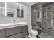 Modern bathroom features sleek vanity, mirrored cabinet, and glass-enclosed shower with stylish tile and built-in niche at 6955 N Durango Dr # 1074, Las Vegas, NV 89149