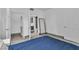 Spacious bedroom showcasing tile floors, walk-in closet, full-length mirror, and access to an ensuite bathroom at 6955 N Durango Dr # 1074, Las Vegas, NV 89149