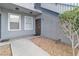 Unit entrance showcases a security door, gravel landscaping, and stairs leading to upper levels at 6955 N Durango Dr # 1074, Las Vegas, NV 89149