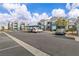Exterior shot of the condo complex with parking, landscaping and colorful exterior paint scheme at 6955 N Durango Dr # 1074, Las Vegas, NV 89149