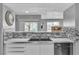 Kitchen featuring a stainless steel sink, modern fixtures, and decorative accents at 6955 N Durango Dr # 1074, Las Vegas, NV 89149