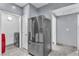 Functional laundry room with side-by-side appliances, conveniently located near kitchen and hallway at 6955 N Durango Dr # 1074, Las Vegas, NV 89149