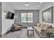 Bright sitting room with neutral decor, featuring a comfortable sofa and chairs at 6955 N Durango Dr # 1074, Las Vegas, NV 89149
