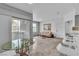 Open-concept living room with breakfast bar and sliding glass door at 6955 N Durango Dr # 1074, Las Vegas, NV 89149