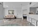 Bright, open-concept living area with neutral tones and view to bedroom, perfect for relaxing or entertaining guests at 6955 N Durango Dr # 1074, Las Vegas, NV 89149