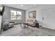 Bright sitting room with neutral decor, featuring a comfortable sofa and chairs at 6955 N Durango Dr # 1074, Las Vegas, NV 89149