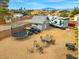 Spacious backyard with a trampoline, outbuilding, and recreational vehicles parked near a patio set at 6995 Rogers St, Las Vegas, NV 89118