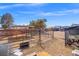 Spacious backyard with a play area, a dog pen and a chicken coop at 6995 Rogers St, Las Vegas, NV 89118