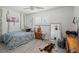 Cozy bedroom with charming decor, patterned bedding, and a bohemian vibe, creating a unique retreat at 6995 Rogers St, Las Vegas, NV 89118