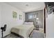 Comfortable bedroom with natural light, neutral colors, and carpet flooring at 6995 Rogers St, Las Vegas, NV 89118