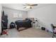 Cozy bedroom with a comfortable bed, ample natural light, and hardwood floors perfect for relaxation at 6995 Rogers St, Las Vegas, NV 89118