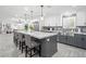 Bright kitchen with a large island, stainless steel appliances, and ample counter space at 6995 Rogers St, Las Vegas, NV 89118