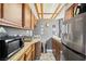 Charming kitchen with wooden cabinets, stainless steel refrigerator, and tile countertops at 6995 Rogers St, Las Vegas, NV 89118