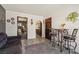 Living area boasts tiled floors, dining set, and seamless transitions to other areas at 6995 Rogers St, Las Vegas, NV 89118