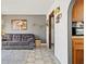 Cozy living room featuring tiled floors, comfortable seating and tasteful decor at 6995 Rogers St, Las Vegas, NV 89118